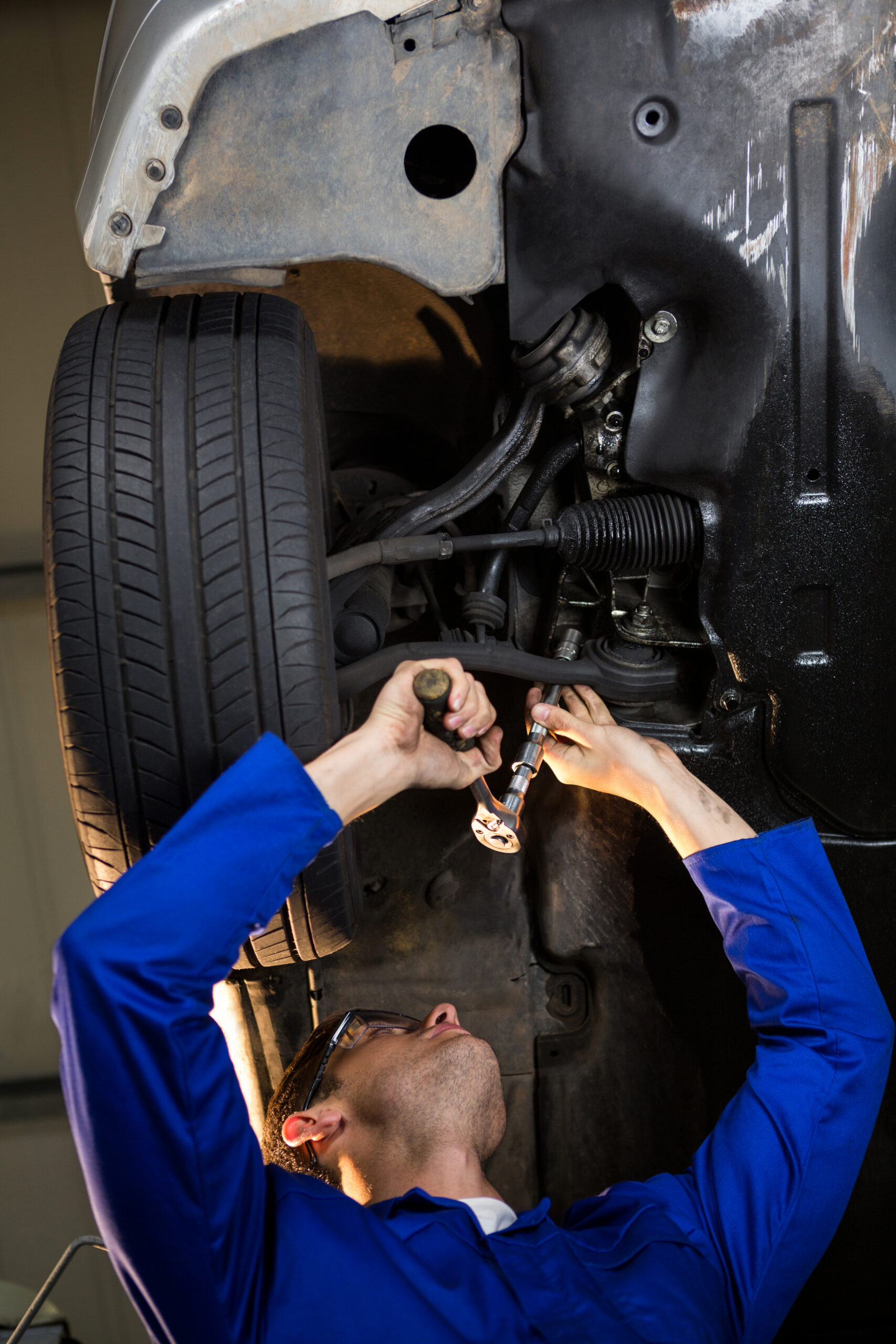 Mechanic servicing a car